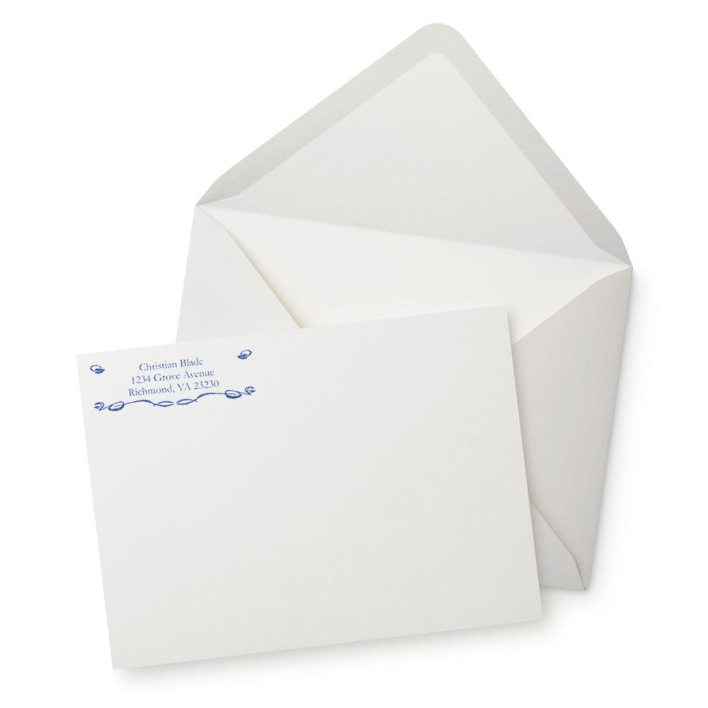 Personalized return address rubber stamp on envelope and card, ideal for custom stationery and professional mailings.