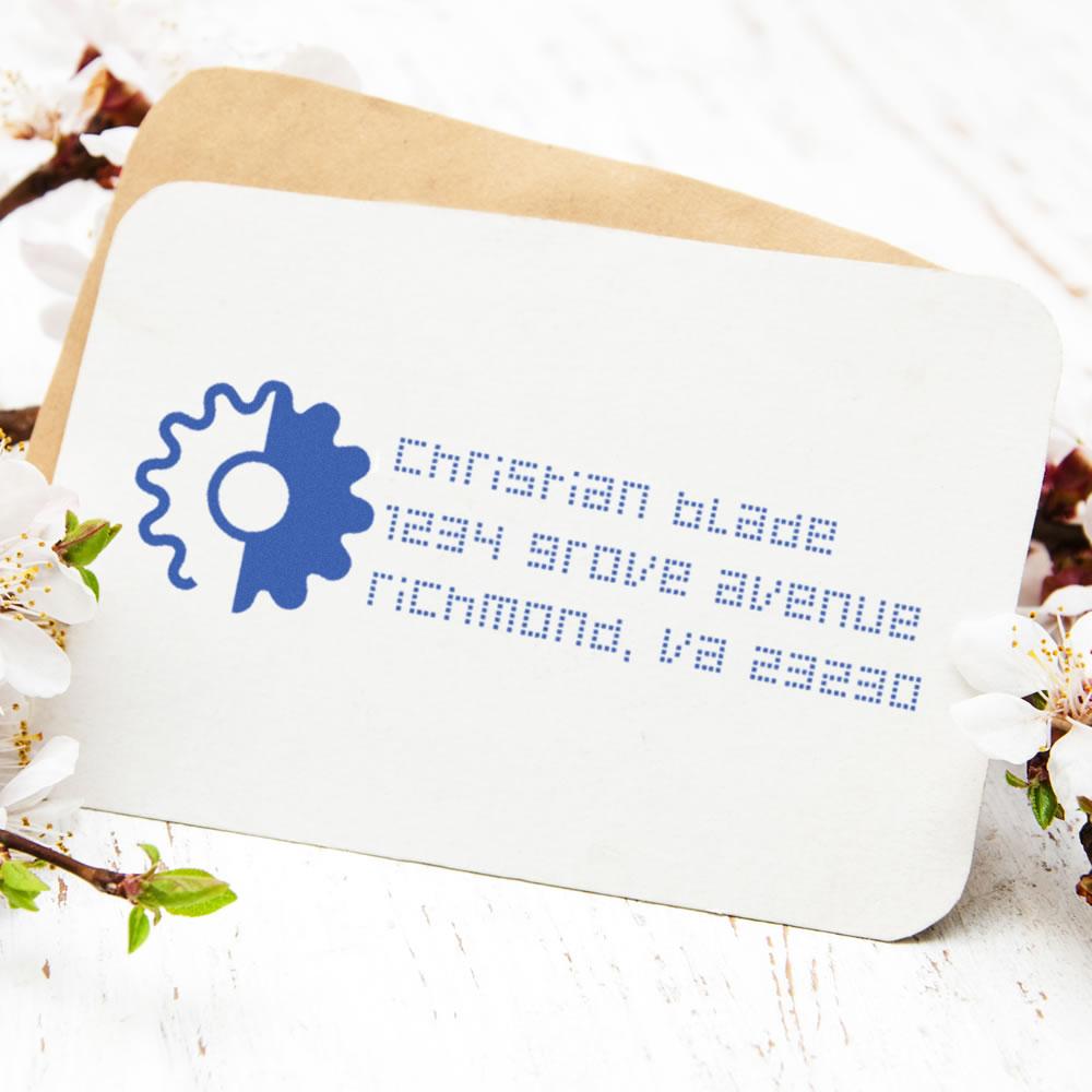 Custom return address rubber stamp on envelope for wedding invitations and business mailing.
