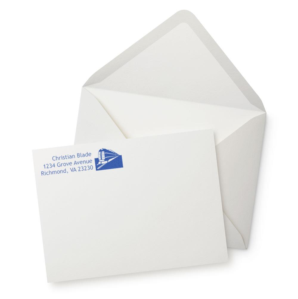 Custom address rubber stamp on envelope, ideal for return mailing and business correspondence.