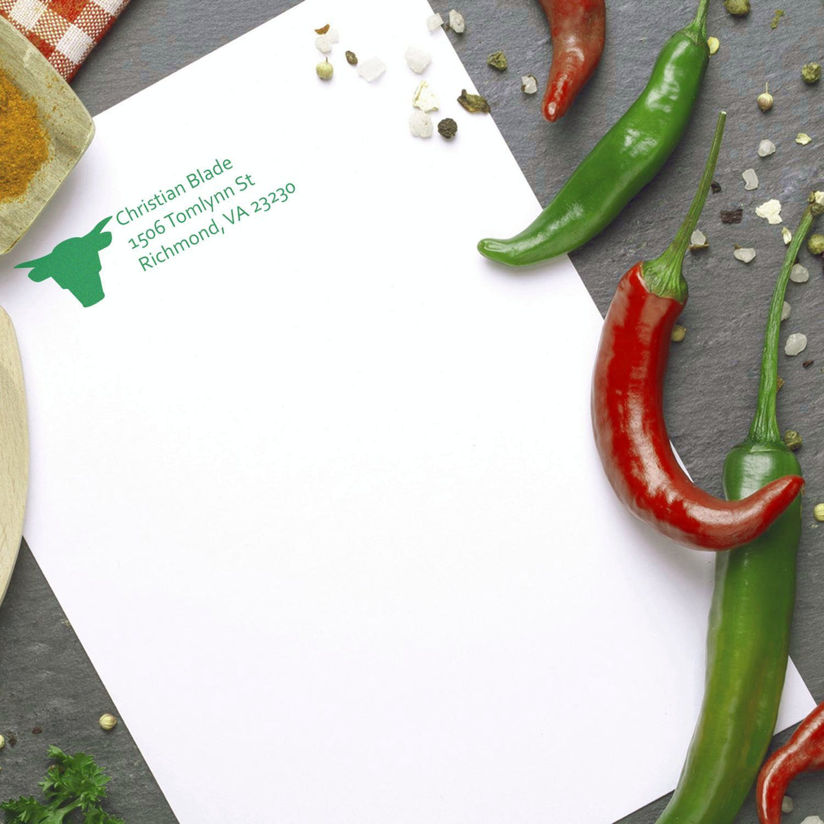 Custom return address rubber stamp with chili pepper logo on white envelope for Christian Blade, Richmond, VA.