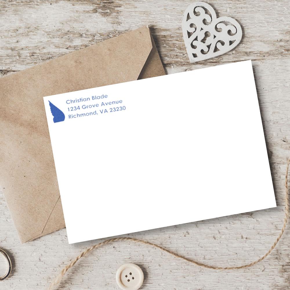 Custom address rubber stamp on white envelope, ideal for wedding invitations, business mail, and package labeling.