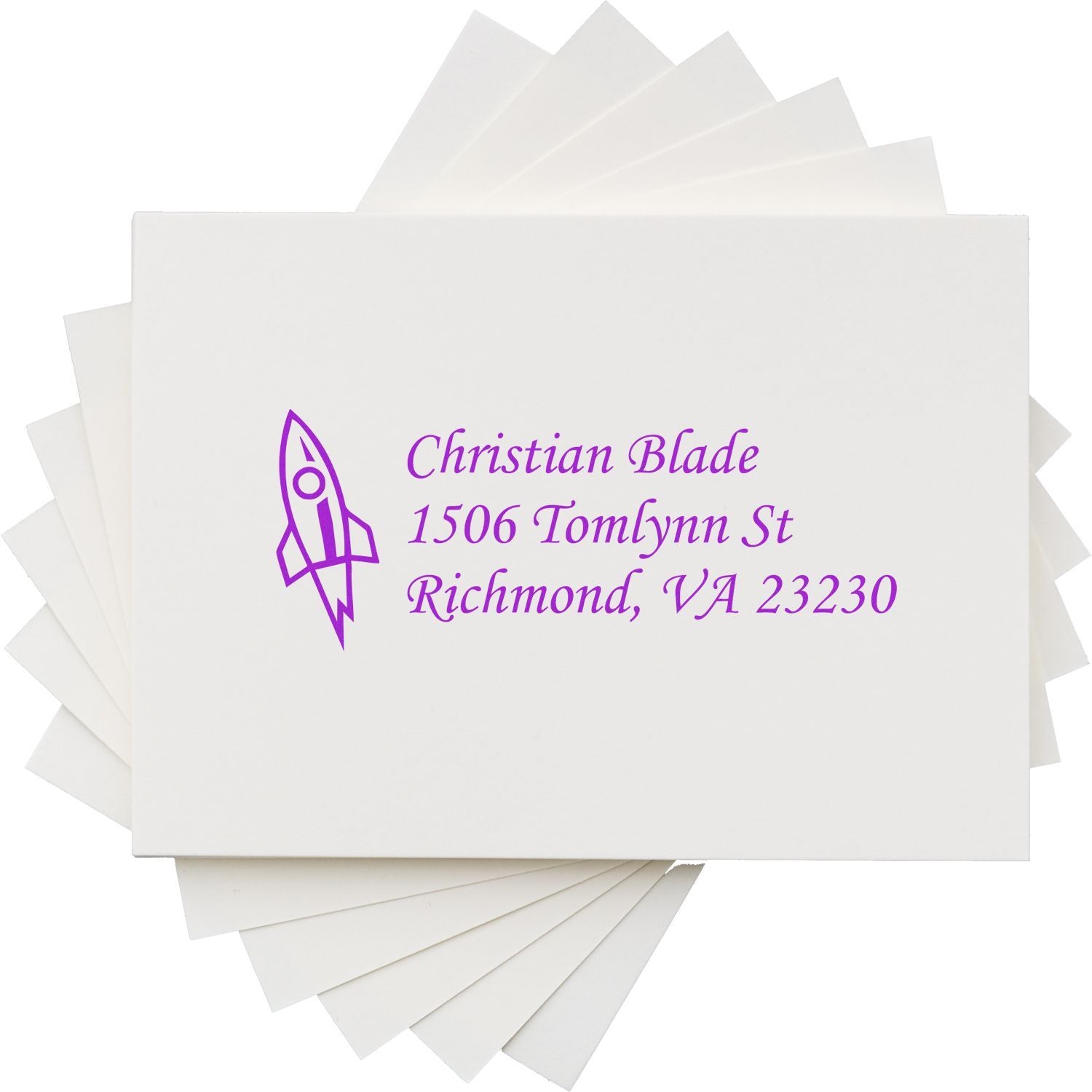 Custom return address rubber stamp with rocket logo, Christian Blade, 1506 Tomlynn St, Richmond, VA 23230 in purple.