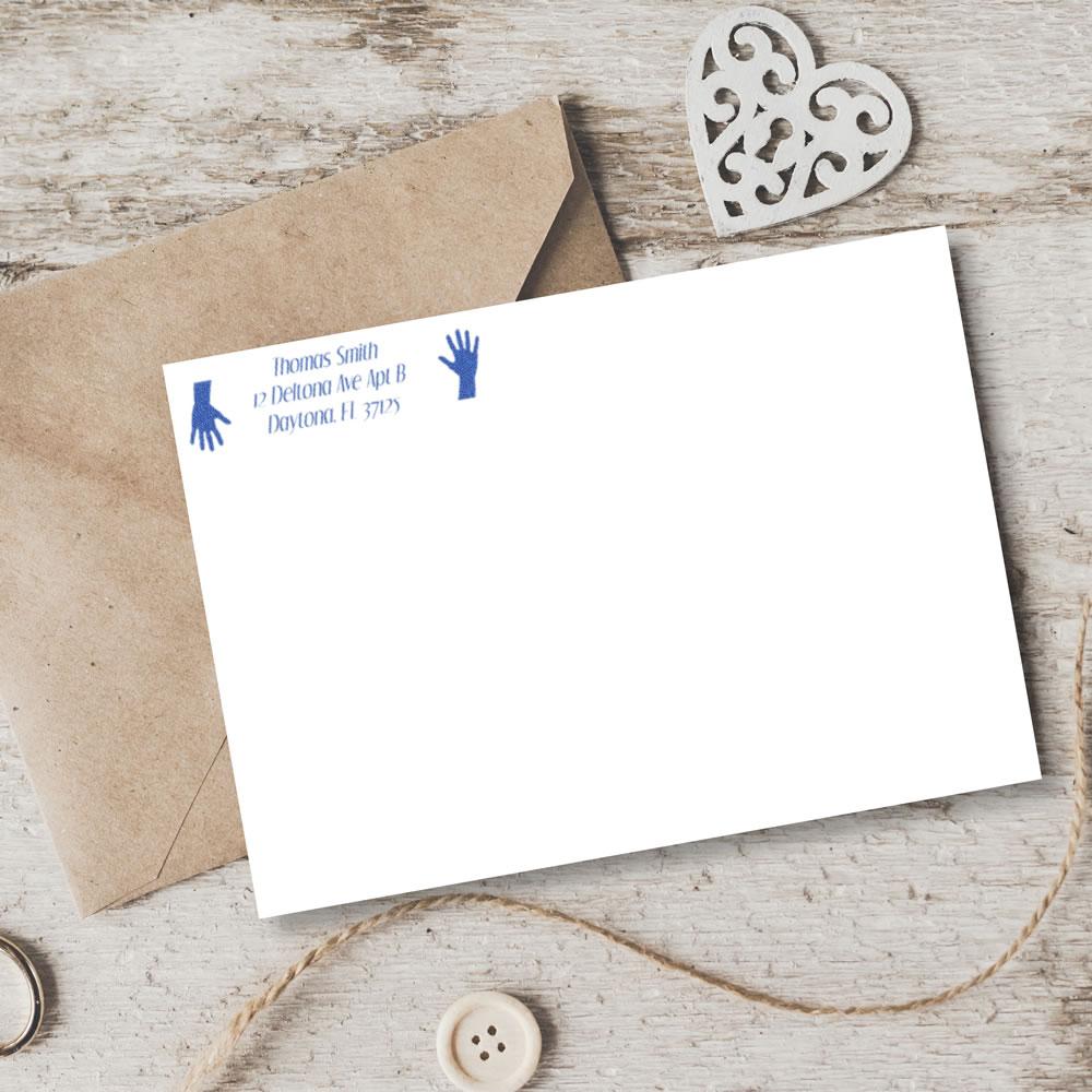 Return address rubber stamp on envelope and card for mailing invitations and business correspondence