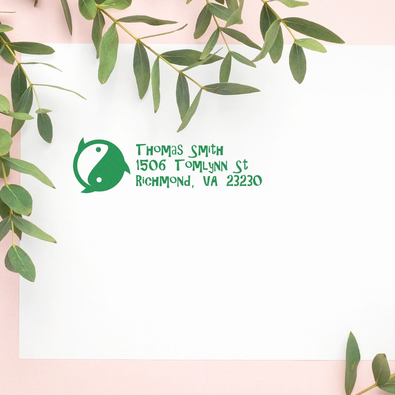 Custom return address rubber stamp with yin-yang logo and Thomas Smith address for personalized mailing and packaging.
