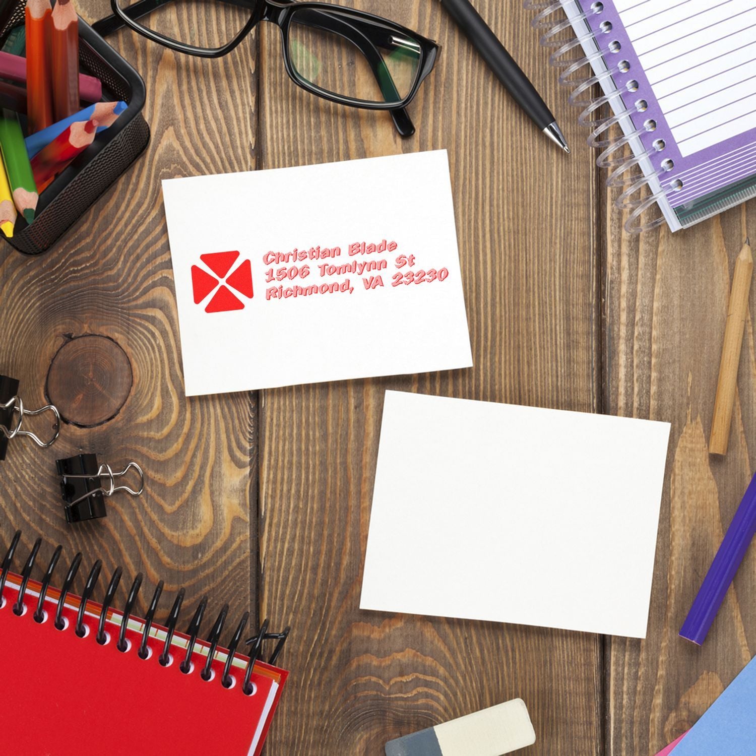 Personalized return address rubber stamp on a card, ideal for mailing, office stationery, and branding.