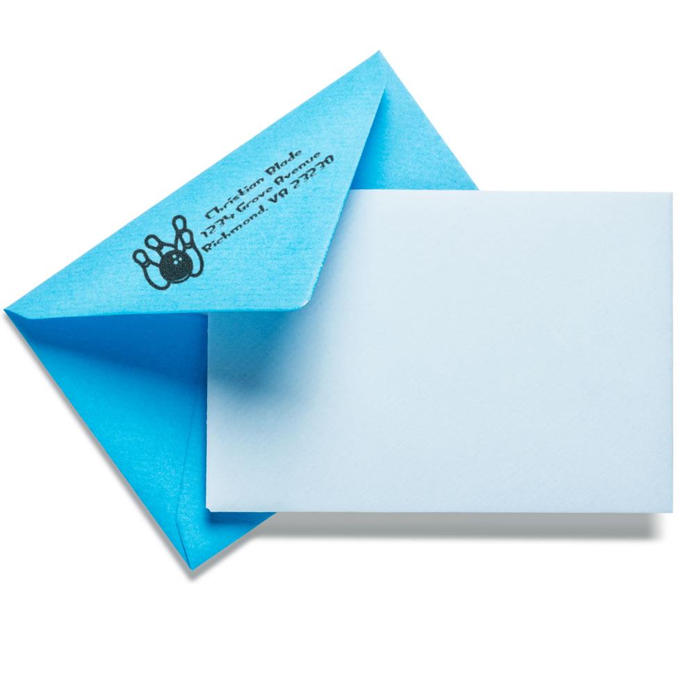 Custom return address rubber stamp on blue envelope with blank card, ideal for branded mailing and stationery.
