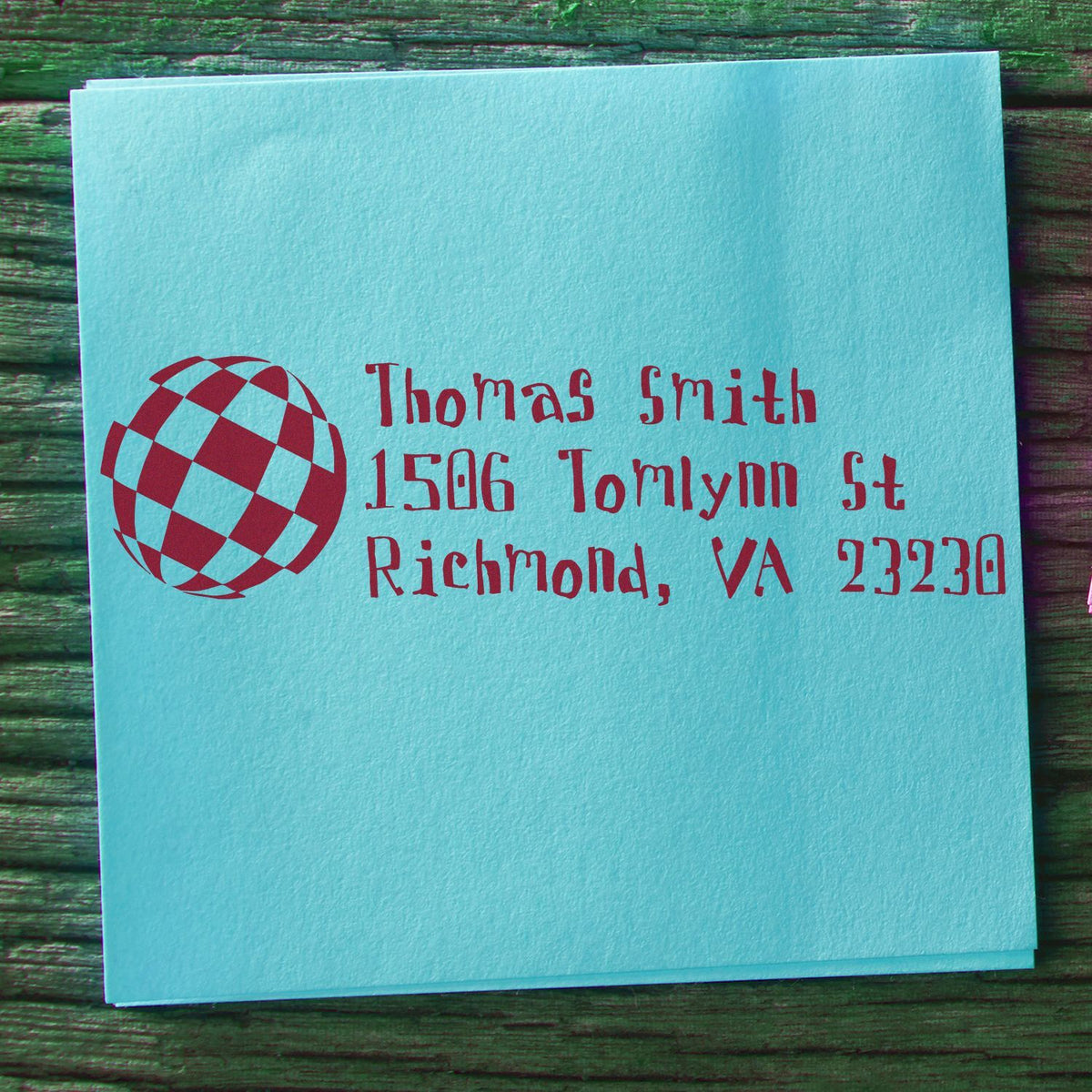 Personalized address rubber stamp on a blue envelope, showing Thomas Smiths Richmond, VA return address with globe logo.