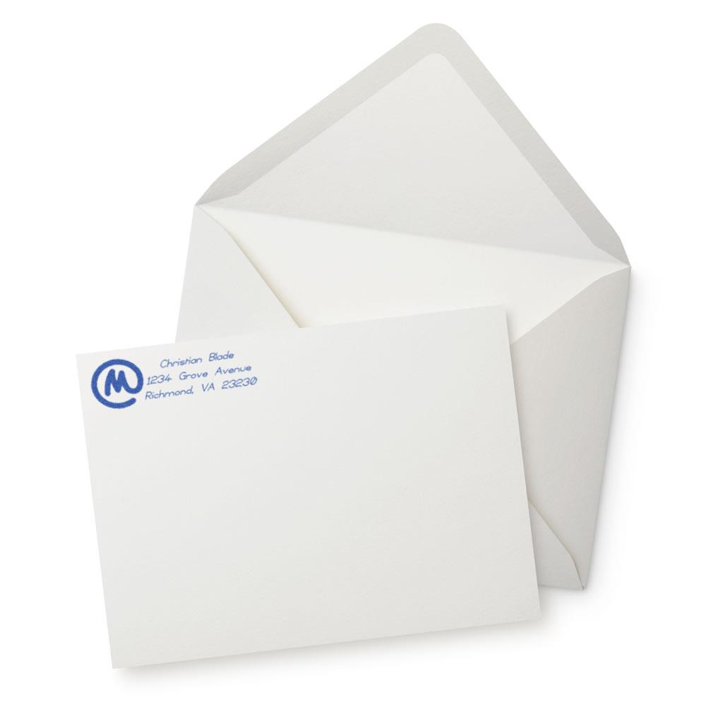 Personalized return address rubber stamp on white envelope and stationery, perfect for business mail and custom mailing.