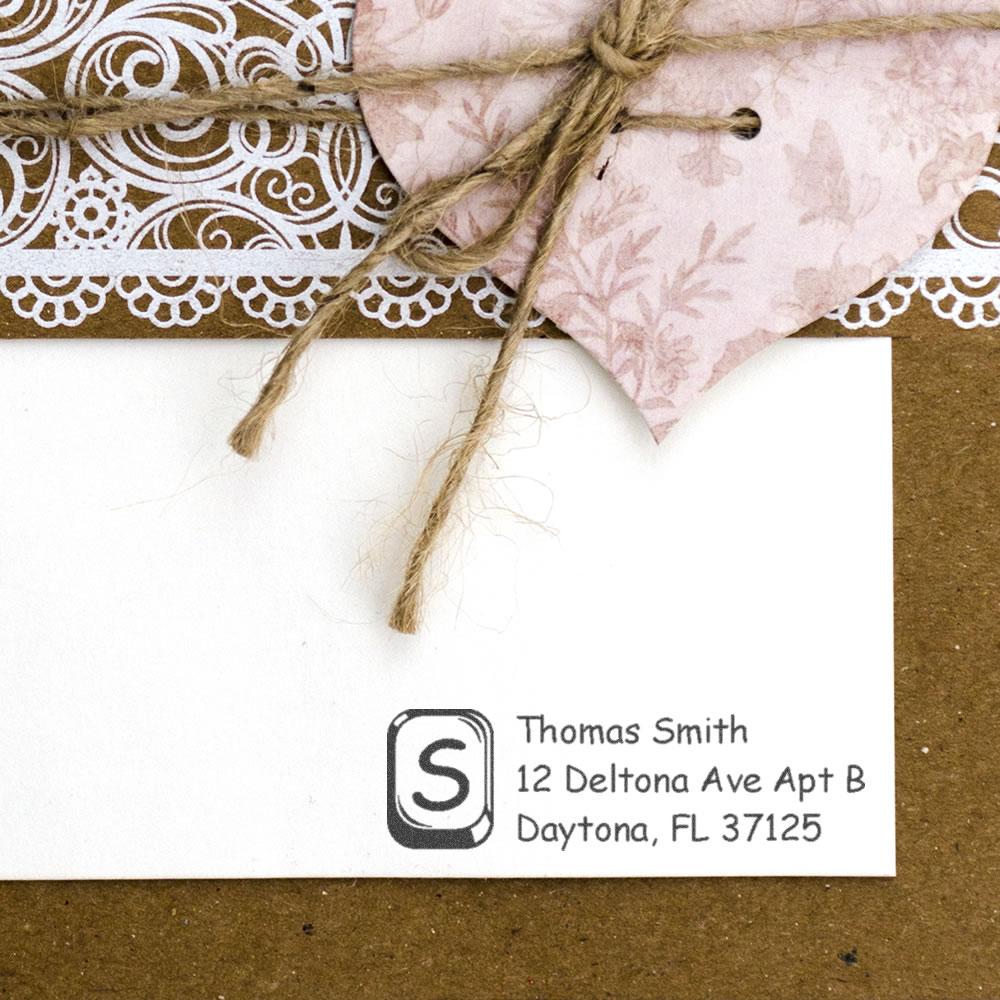 Custom return address rubber stamp on handmade stationery, featuring Thomas Smiths Daytona, FL address for personalized mail.