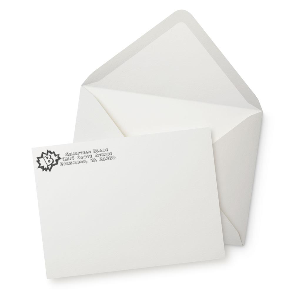 Custom address rubber stamp on white envelope and stationery paper, ideal for return address mailing and business correspondence.