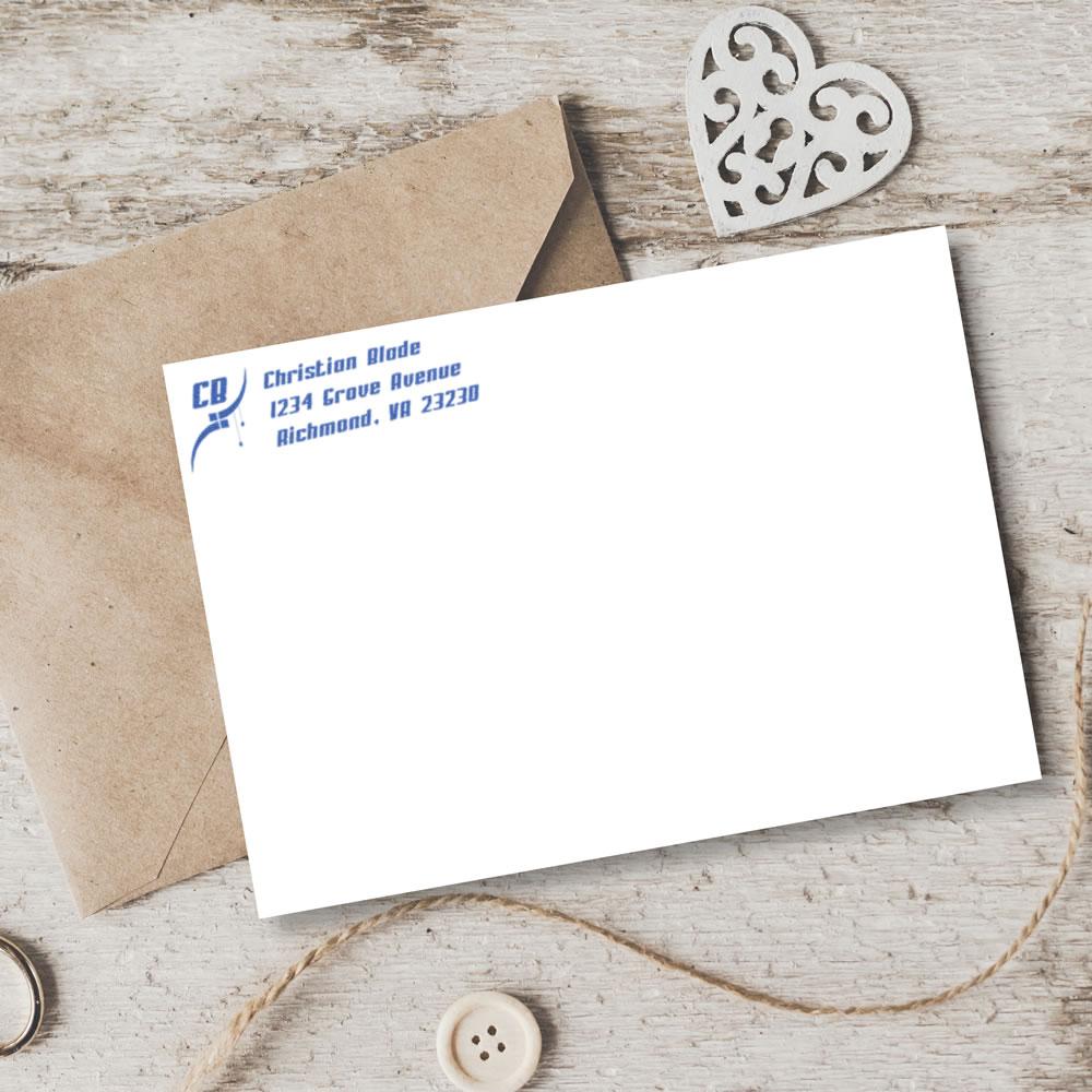 Custom address rubber stamp on envelope and card, ideal for personalized business stationery and mailings.