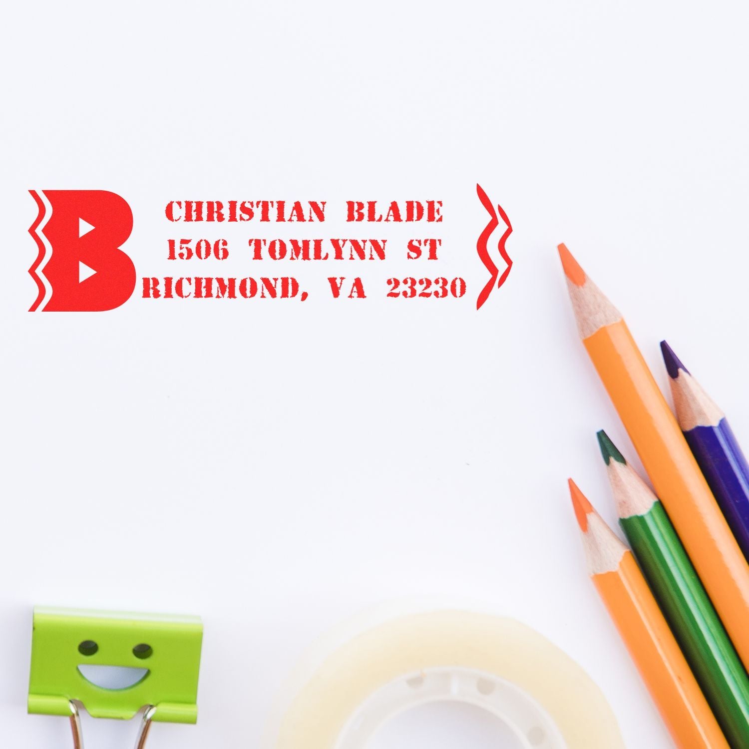 Custom red address rubber stamp impression for Christian Blade in Richmond, VA, with colored pencils on white paper.