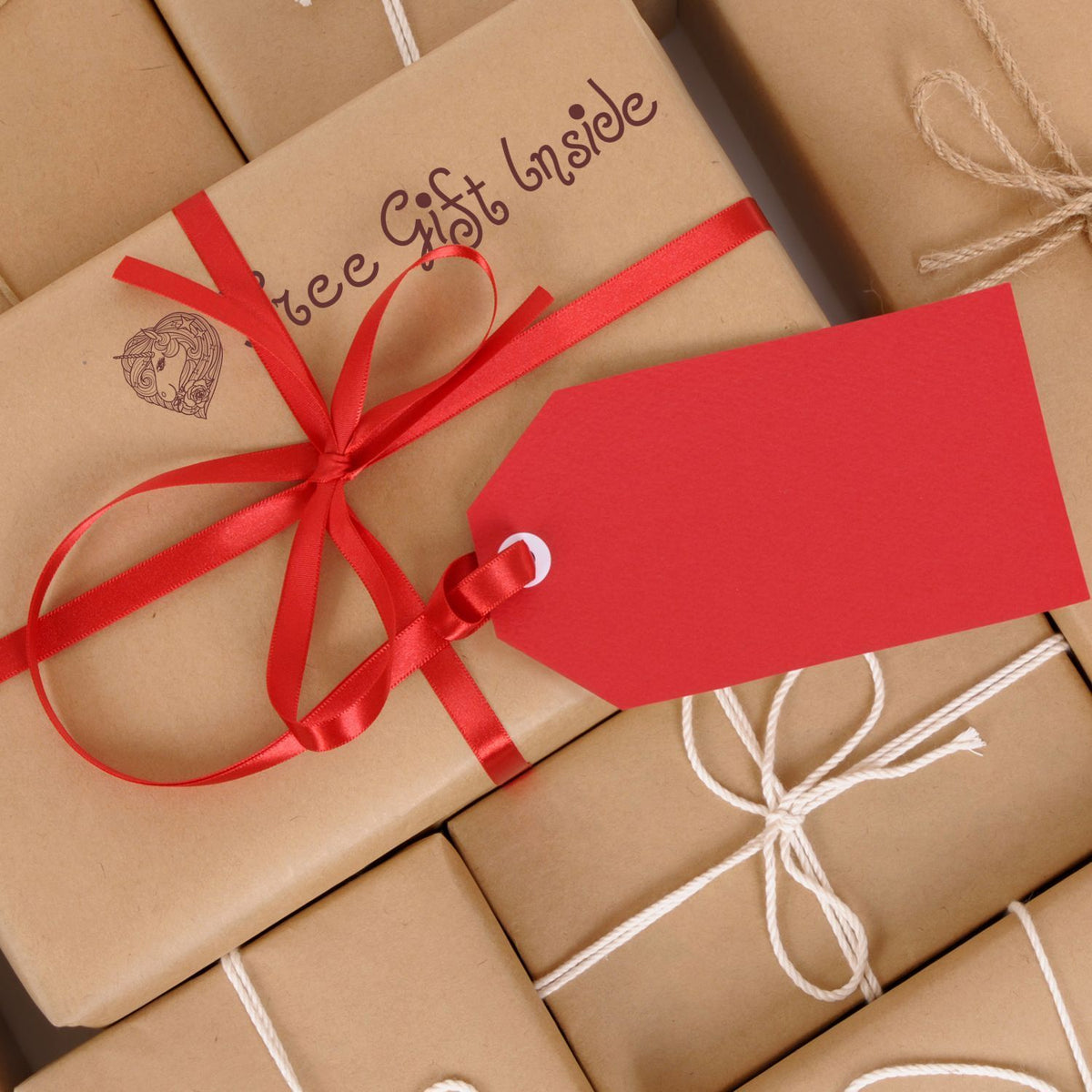 Brown gift boxes tied with red ribbon and white string, ecommerce-ready packaging for birthdays, holidays, online gifting, and delivery.