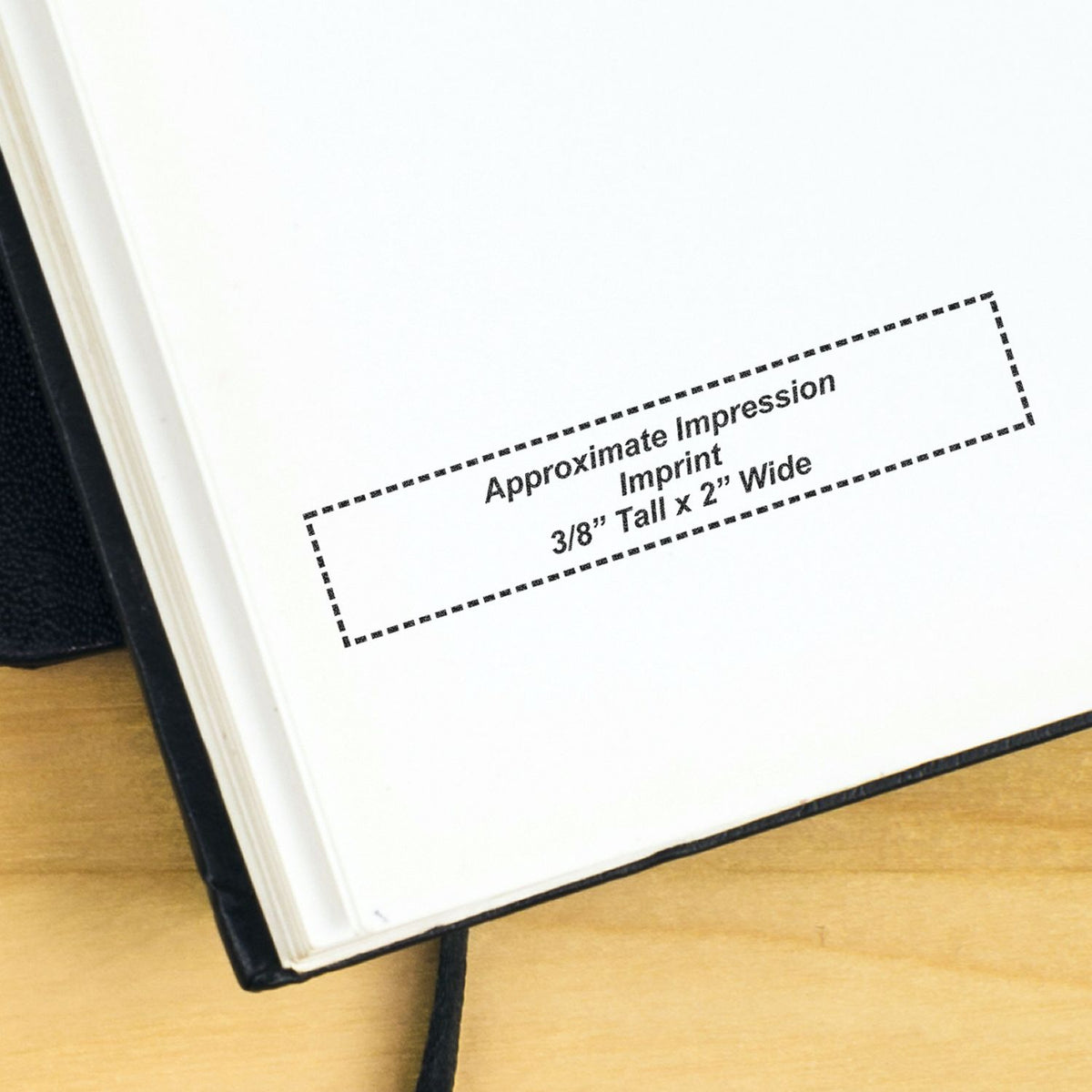 Close-up of an open book page showing an Approximate Impression Imprint 3/8 Tall x 2 Wide size guide.
