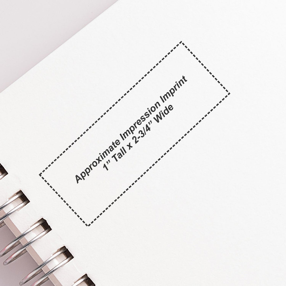 Blank spiral notebook page with approximate impression imprint box, 1" tall x 2-3/4" wide.