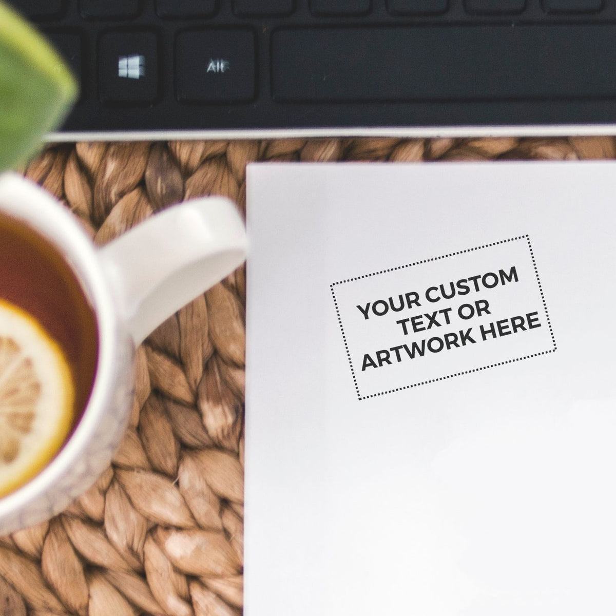 Blank custom artwork mockup on desk with coffee cup and laptop keyboard, ideal for personalized text or design preview