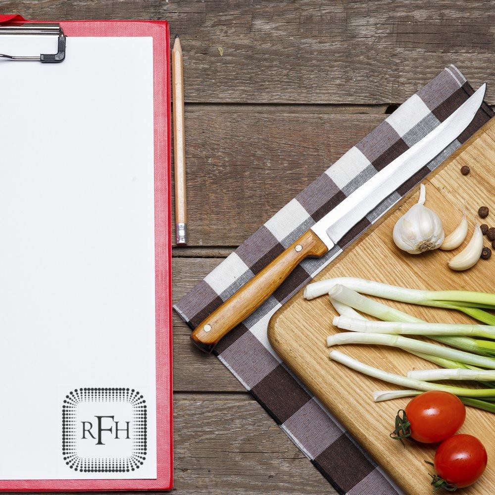 Custom rubber stamp logo mockup on clipboard with blank paper, ideal for business branding and personalized stationery.