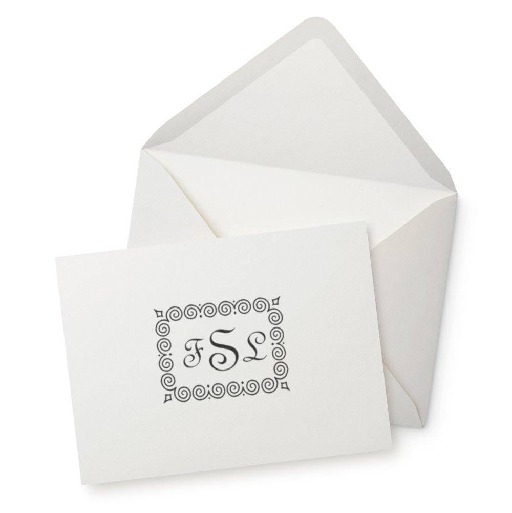 Personalized monogram rubber stamp with decorative swirl border for custom wedding envelopes and stationery.