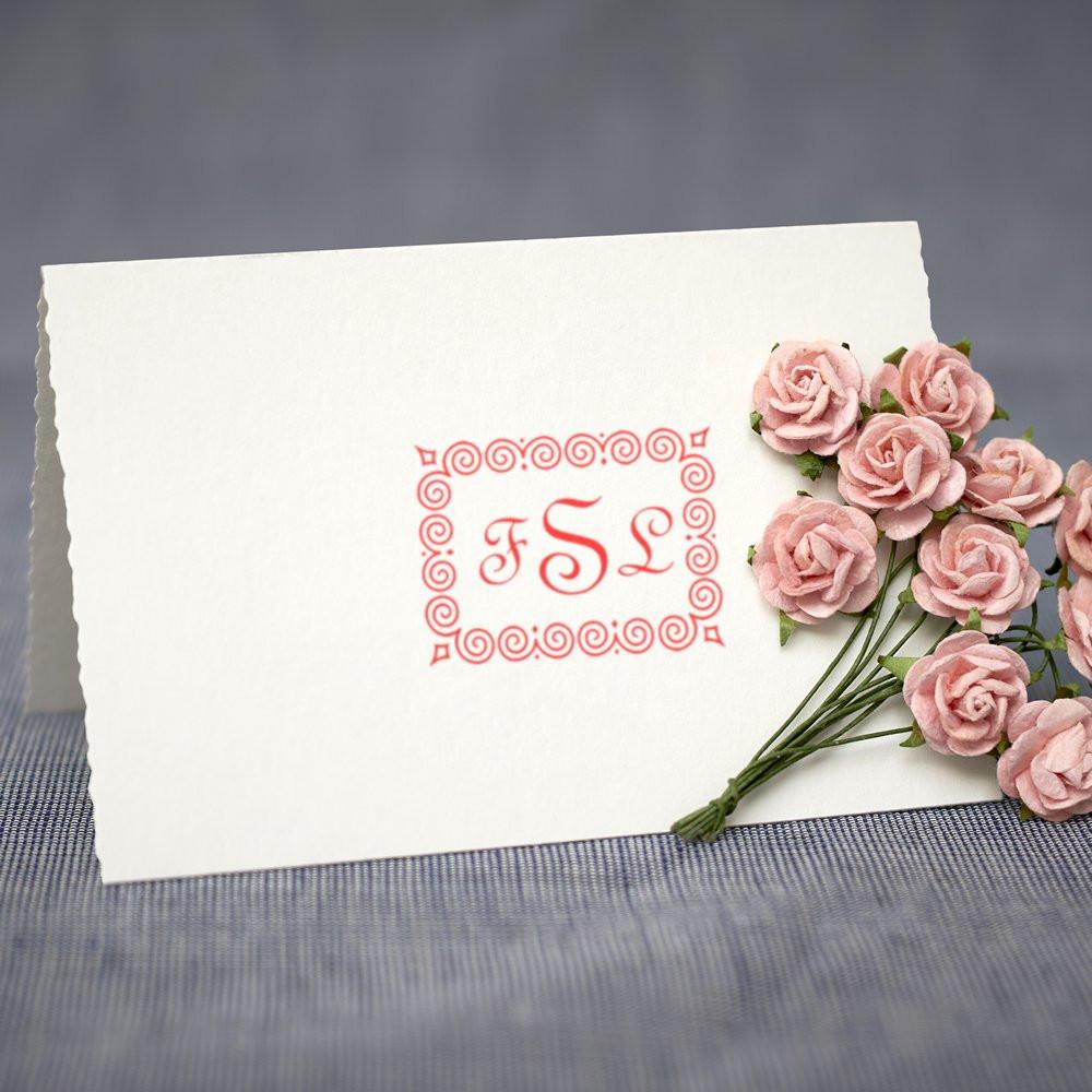 Custom monogram rubber stamp with ornate floral border, ideal for wedding invitations, stationery, and personalized cards.