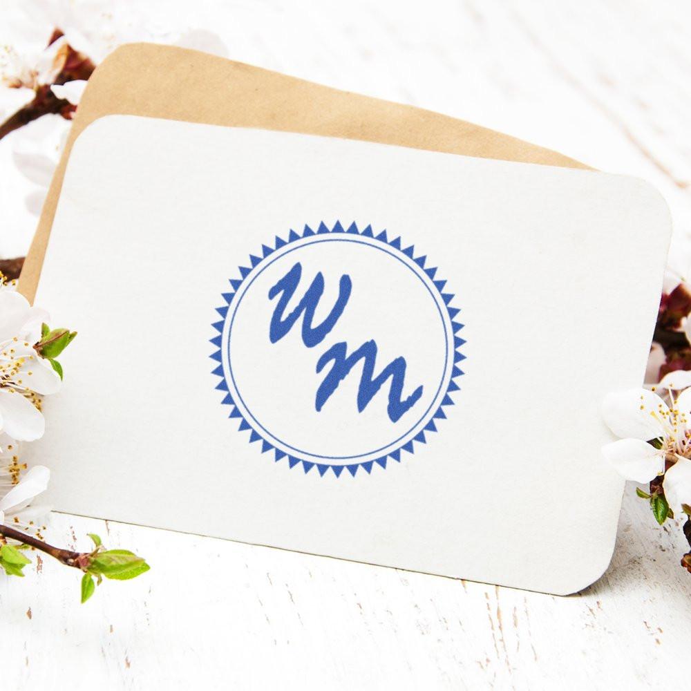Custom monogram rubber stamp with blue WM initials, perfect for wedding invitations, stationery, and branding.