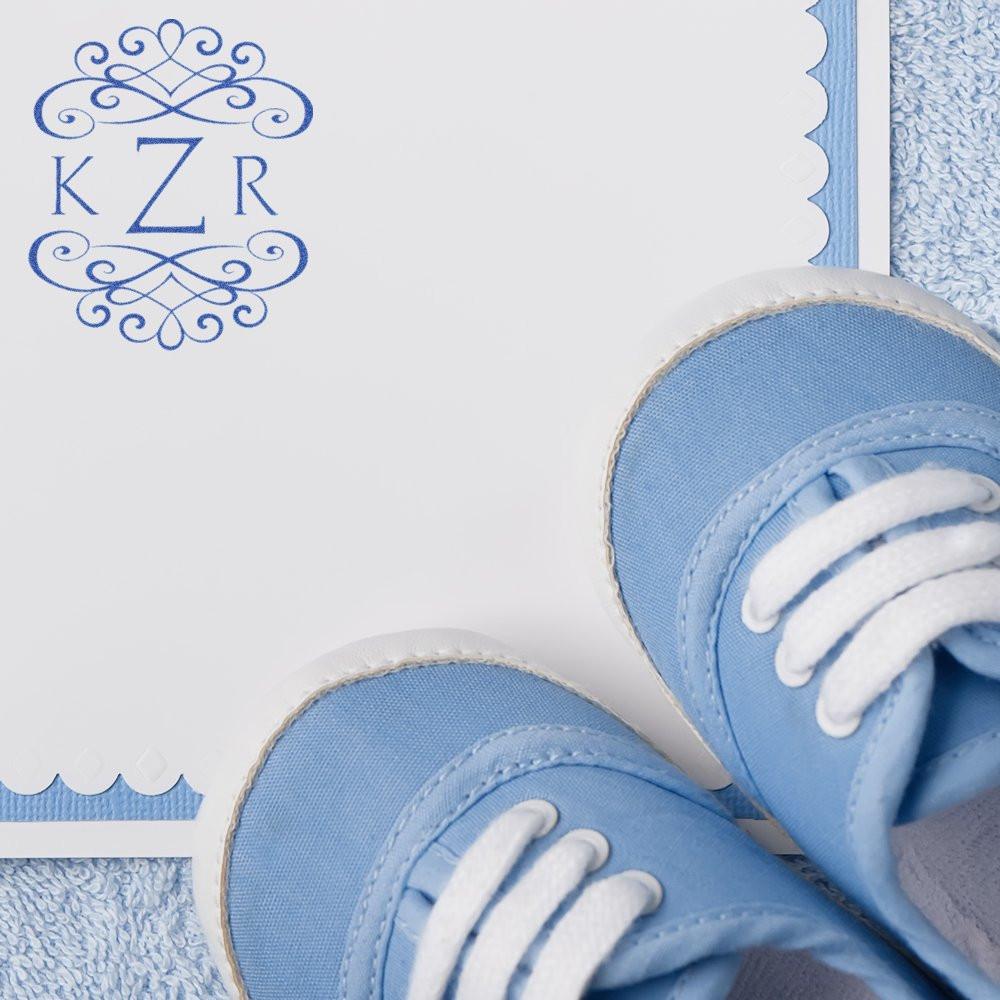 Personalized baby blue sneaker with KZR monogram on soft fabric background, featuring laces and stitched toe detail.