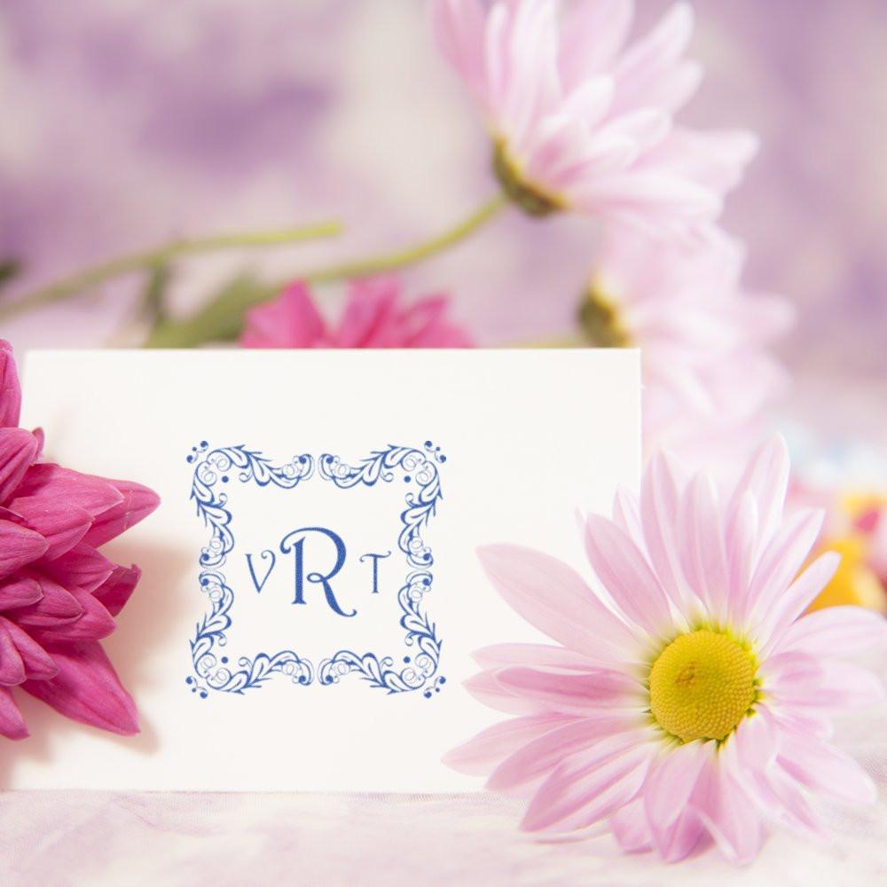 Custom floral monogram rubber stamp with ornate VRT initials, styled on a soft pink flower-themed card.