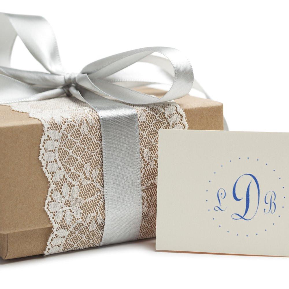 Elegant wedding gift boxes with silver satin ribbon, lace trim, and a personalized LB card on top.