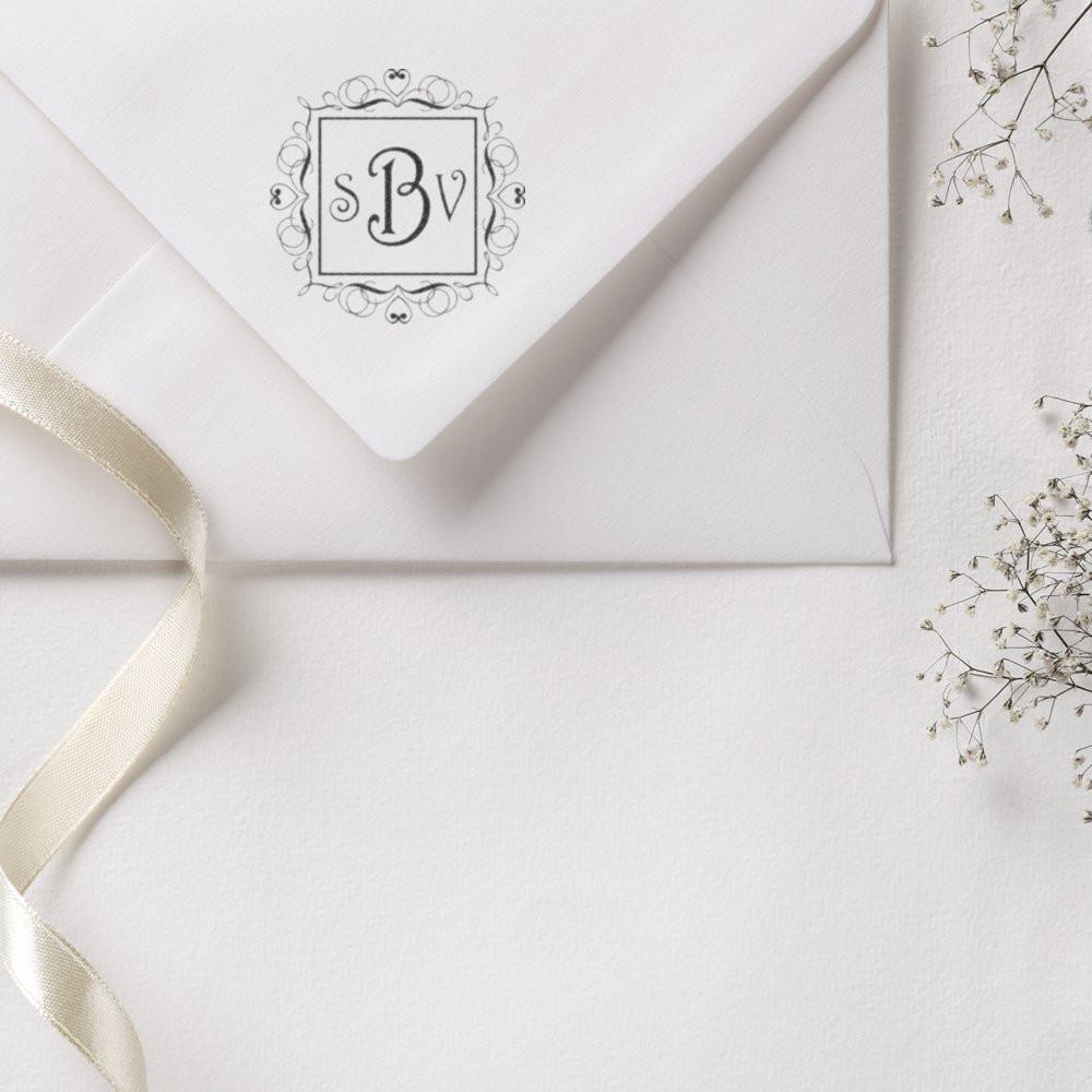 Custom monogram rubber stamp on wedding envelope, ideal for elegant wedding invitations and stationery.