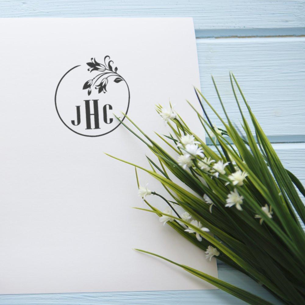 Custom floral monogram rubber stamp imprint with initials JHC, ideal for wedding invitations, stationery, and branding.