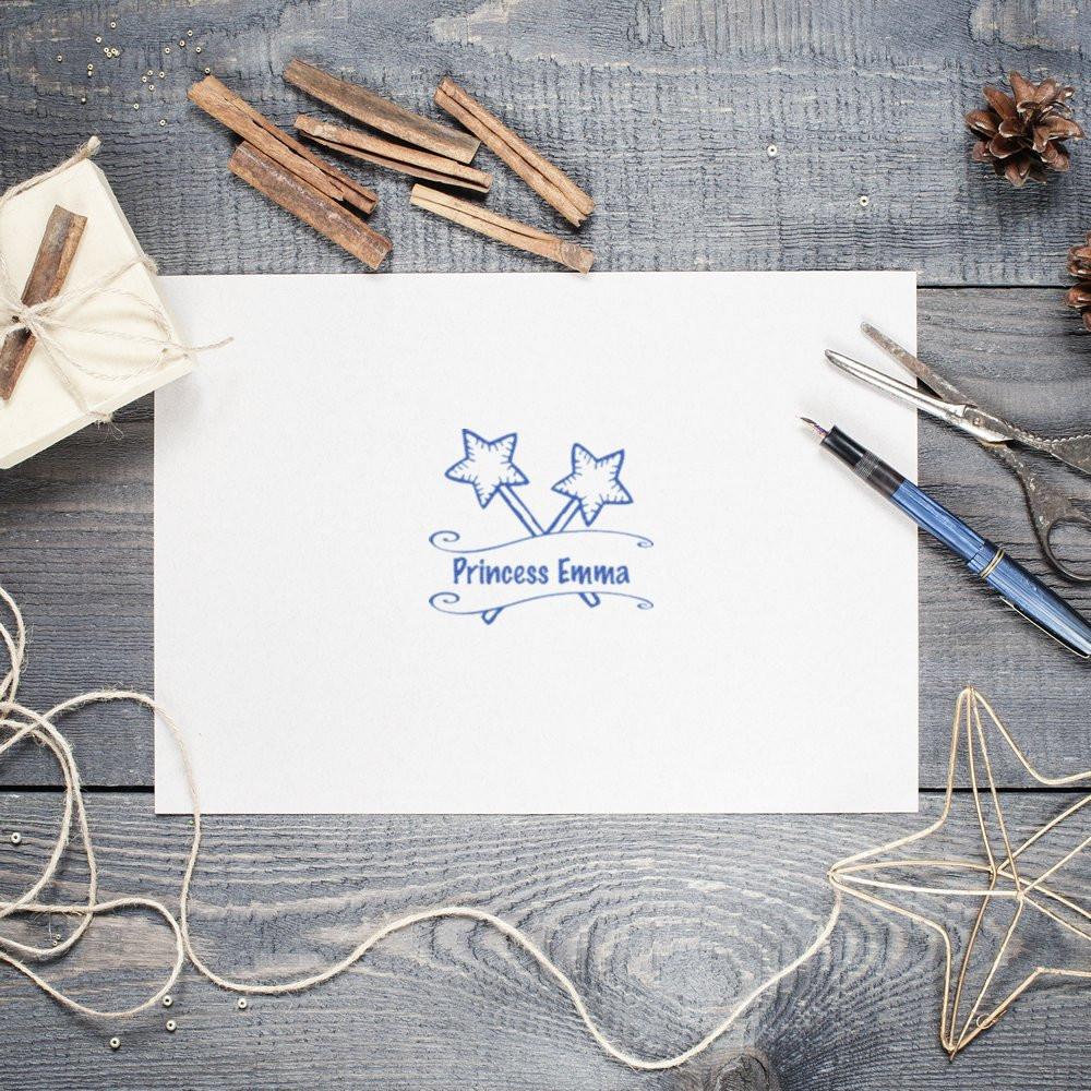 Custom Princess Emma rubber stamp impression with star wands on stationery for personalized kids crafts and labels.