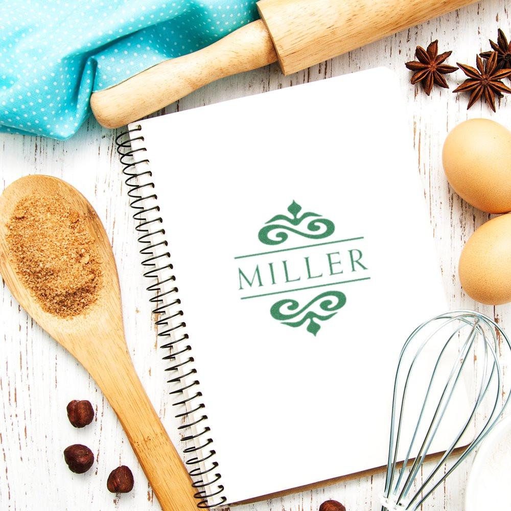 Miller branded recipe notebook with whisk, eggs, wooden spoon and spicesbaking and cooking inspiration background.