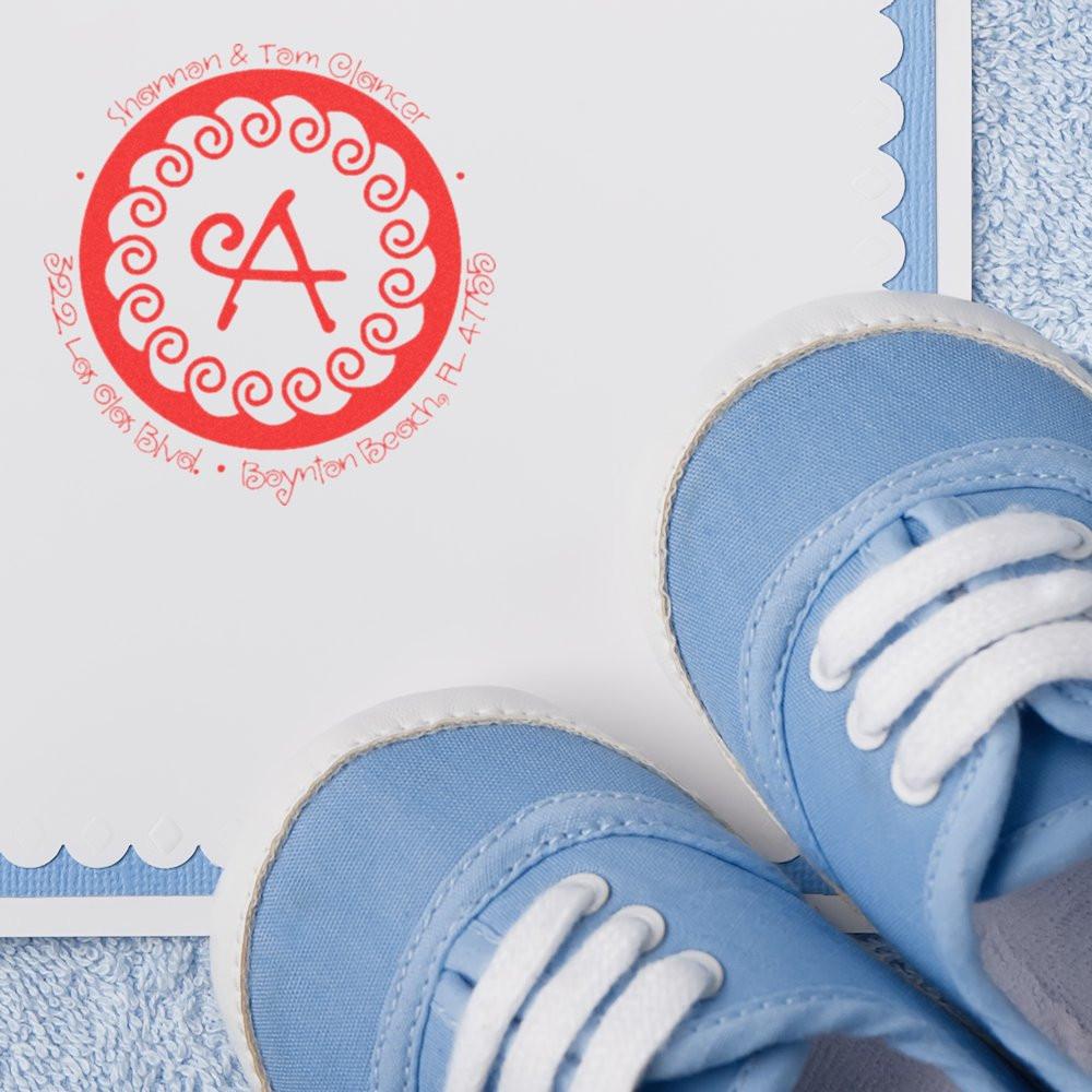 Personalized rubber stamp with monogram and return address for baby announcement cards and stationery.