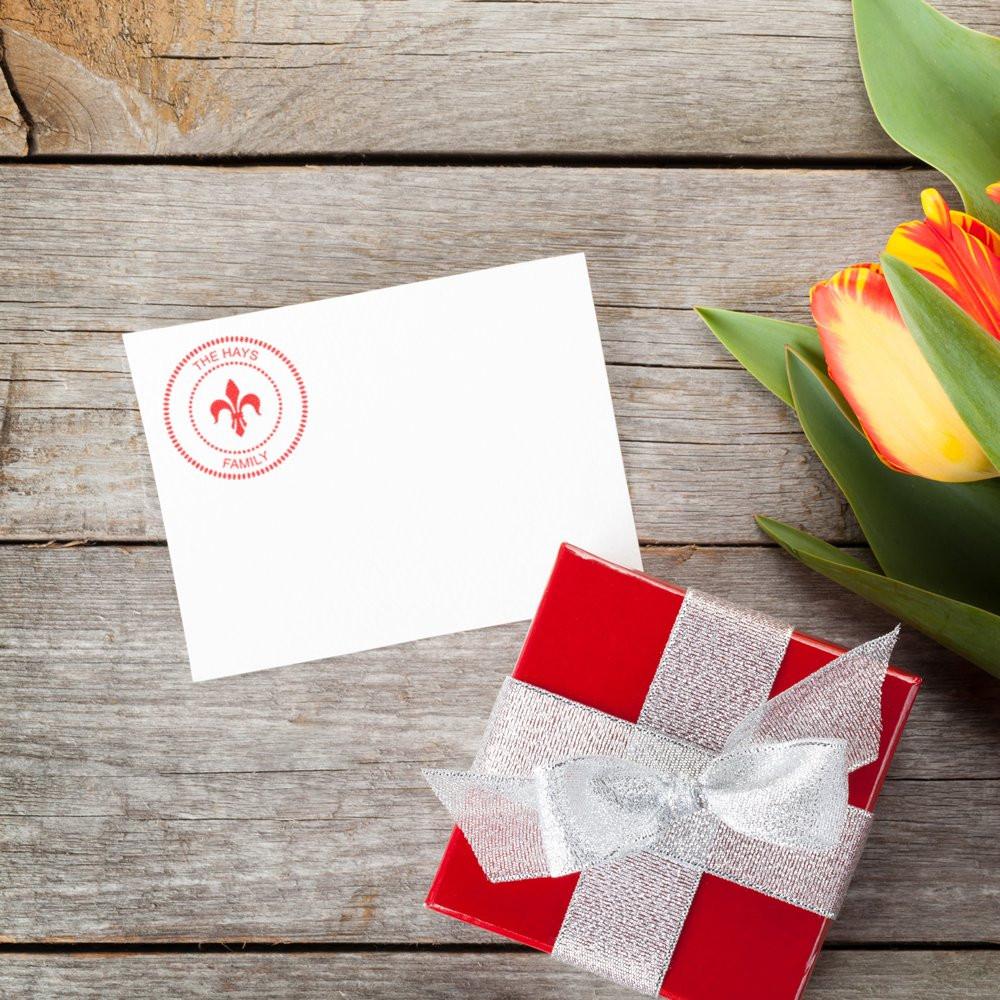 Custom family rubber stamp on gift card with red present and tulips, perfect for personalized wedding or celebration packaging.