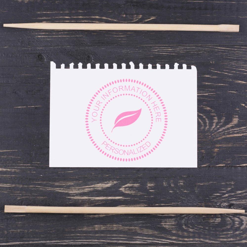 Custom rubber stamp design with pink leaf logo and personalized text for branding stationery, packaging, and small business use.