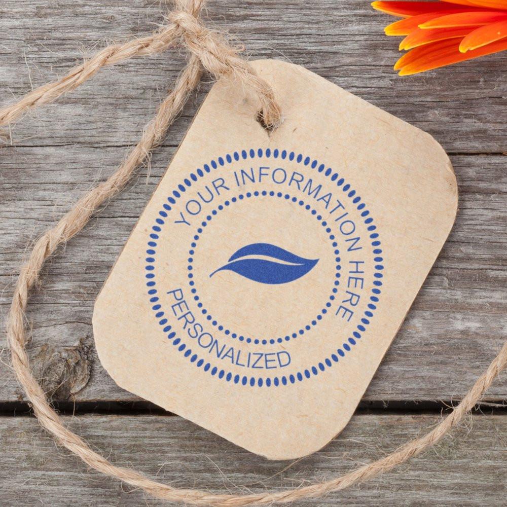 Custom rubber stamp impression on kraft paper tag, ideal for personalized branding, packaging, and handmade product labels.