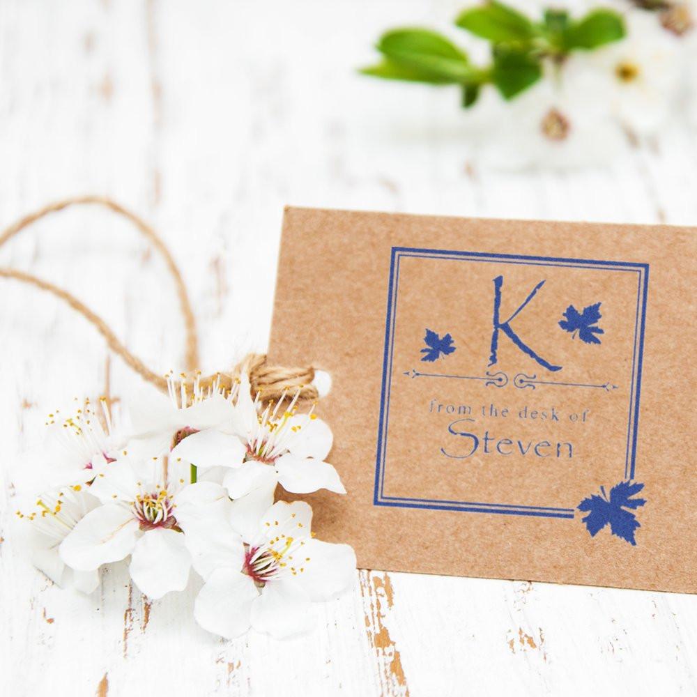 Personalized rubber stamp impression on kraft paper, featuring monogram K and From the desk of Steven stationery design.