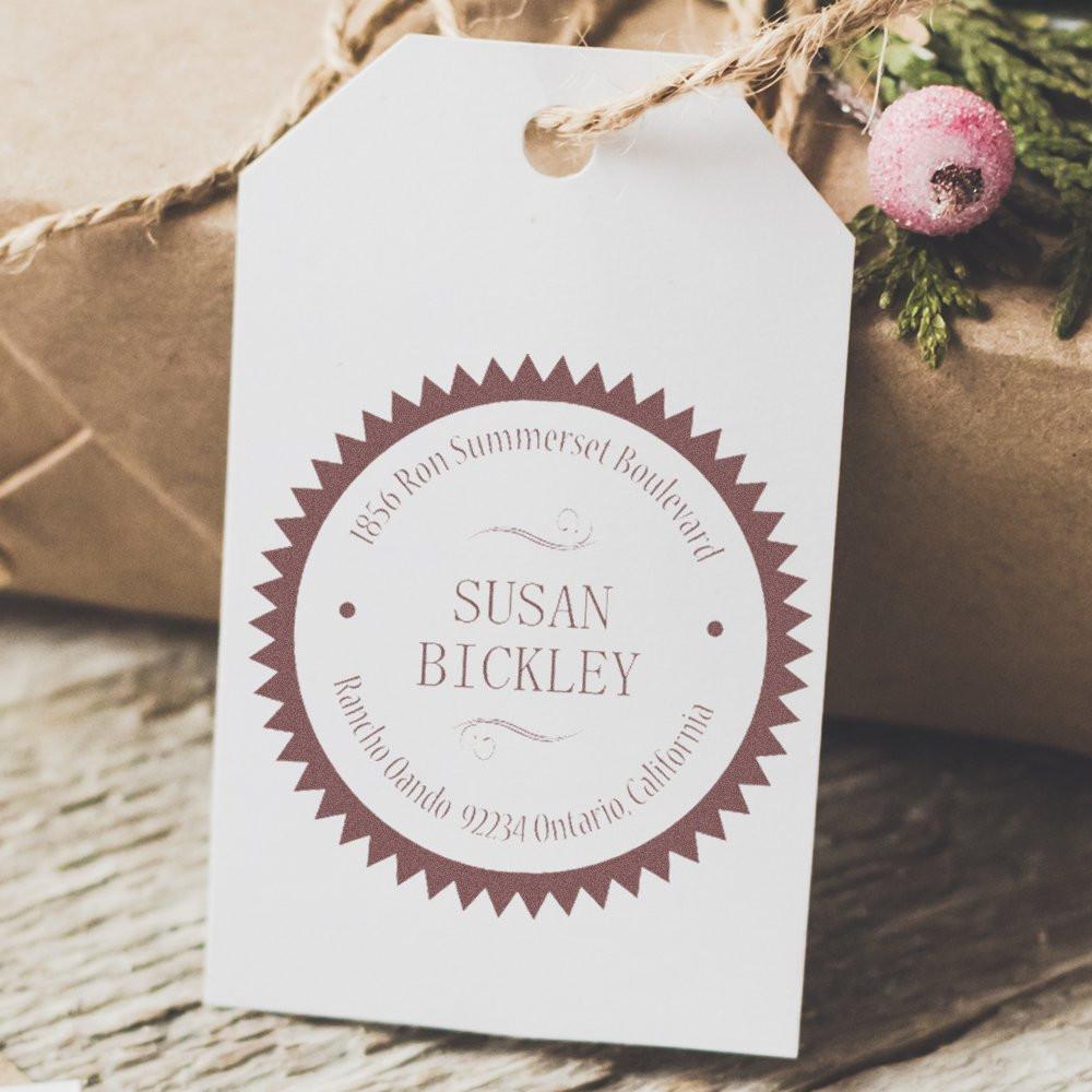 Custom rubber address stamp on personalized gift tag for packaging, featuring Susan Bickley and a vintage spiked border.