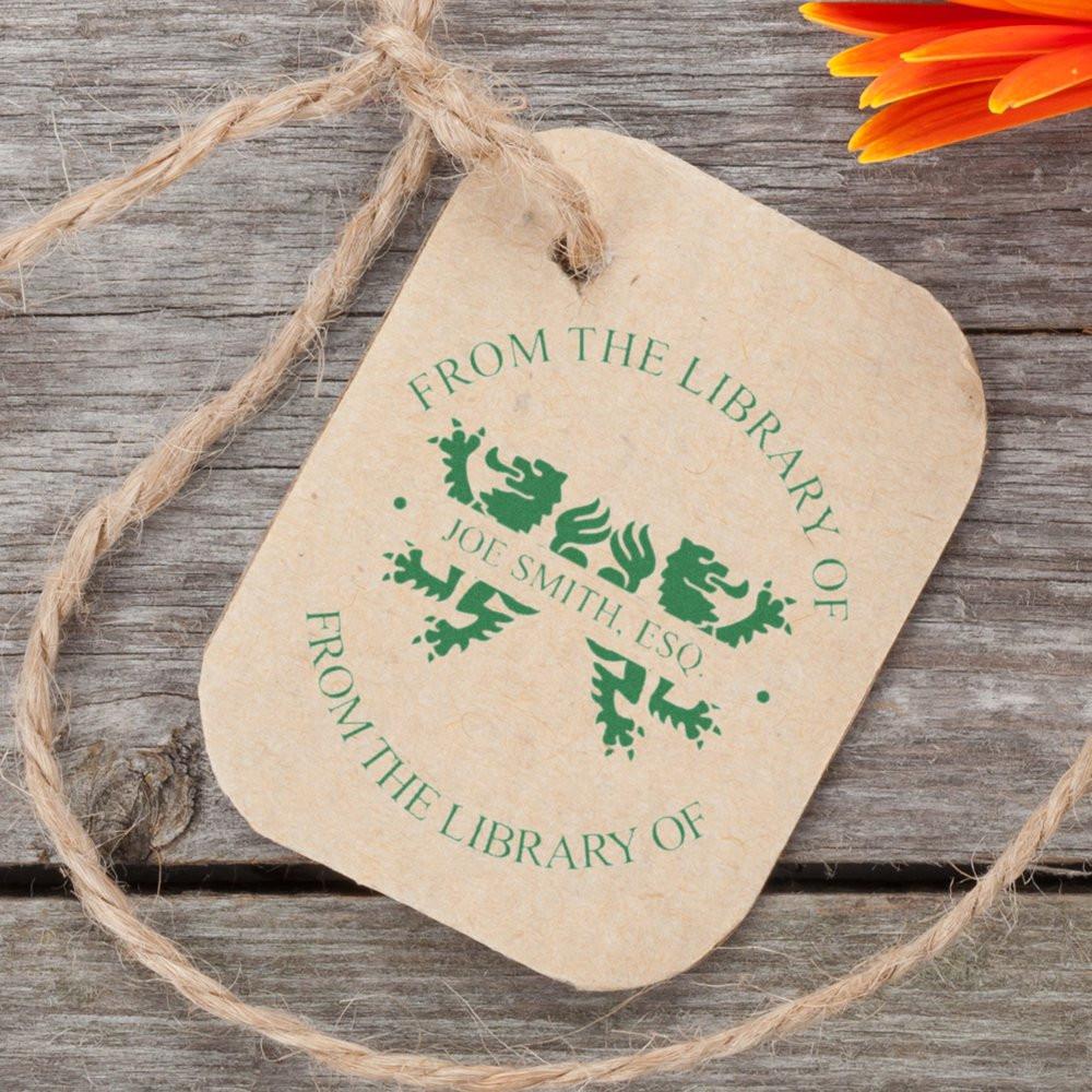 Personalized ex libris rubber stamp on gift tag, reading From the Library of Joe Smith, Esq.