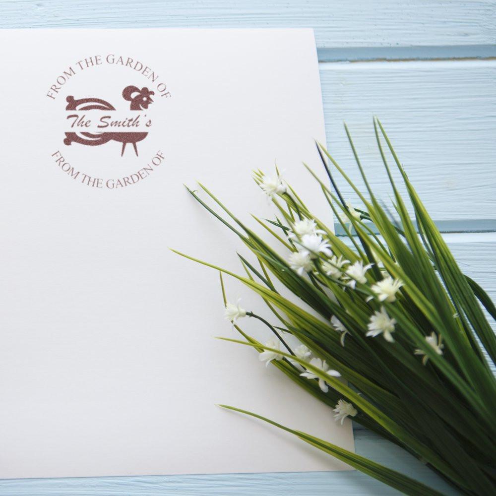 Custom rubber stamp impression reading From the Garden of The Smiths for garden-themed packaging.