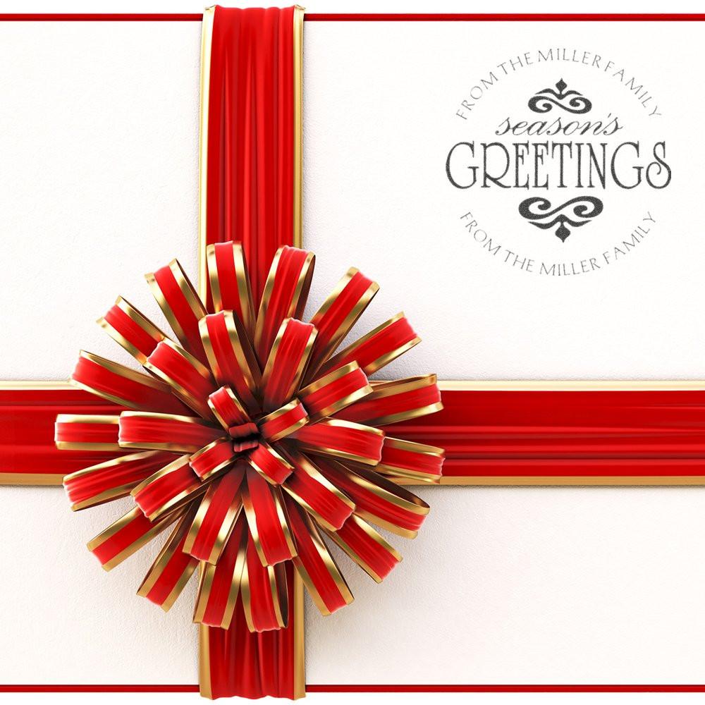 Custom Christmas rubber stamp for holiday cards, featuring a Seasons Greetings family message and festive red ribbon wrap.
