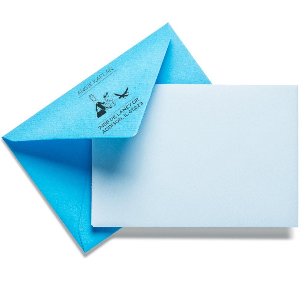 Blue envelope with custom return address rubber stamp, perfect for personalized mailing and wedding invitation envelopes.