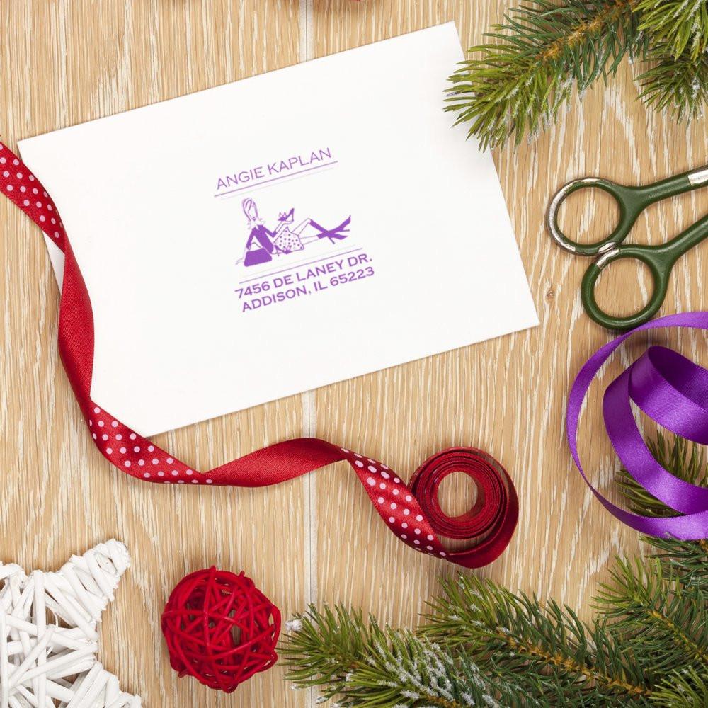 Custom rubber return address stamp impression on envelope with ribbons and scissors, ideal for personalized stationery.
