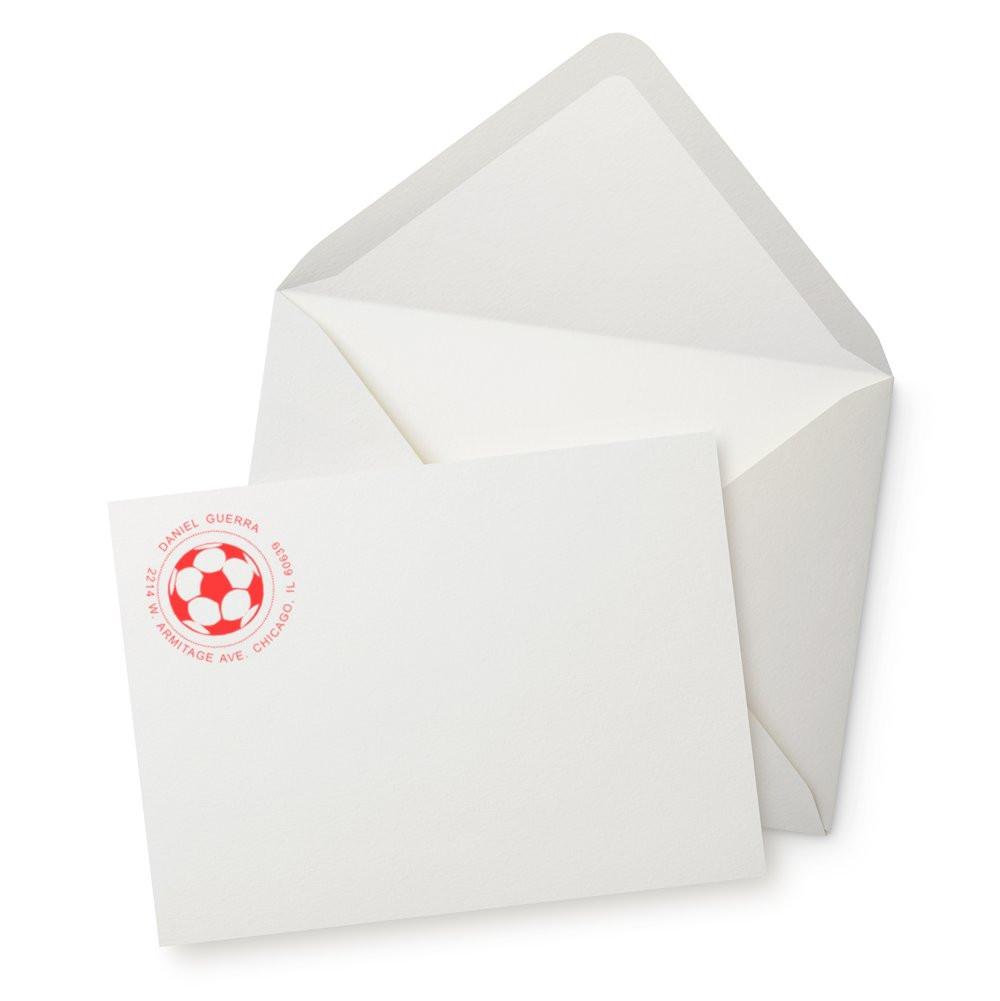 Personalized return address rubber stamp with soccer ball logo on white envelope and stationery for custom mailing.