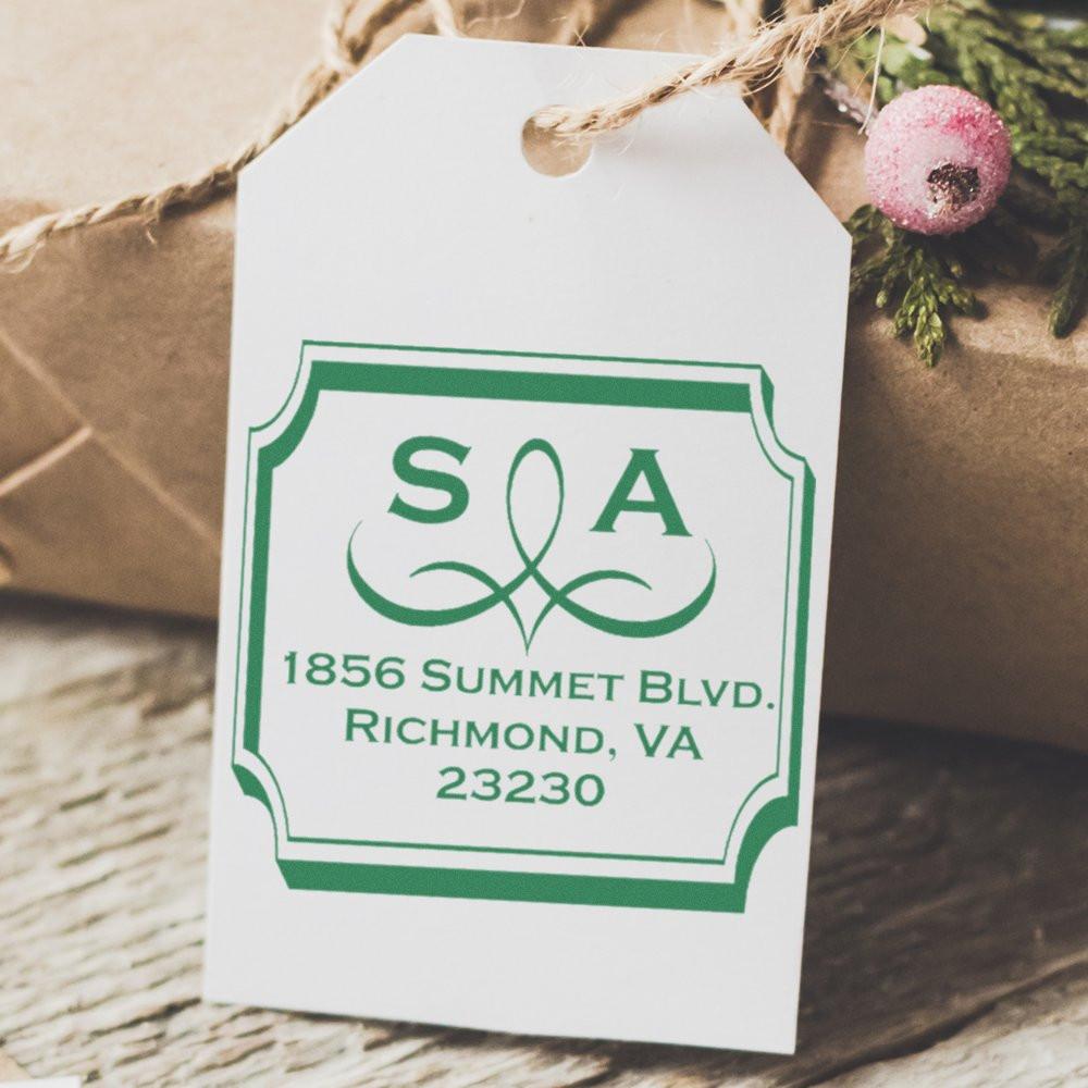 Custom monogram address rubber stamp on a gift tag, showing SA and Richmond, VA mailing details.