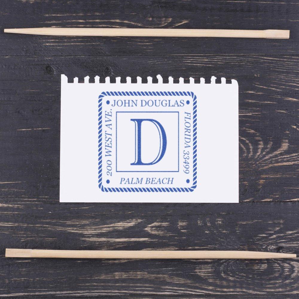 Custom return address rubber stamp with monogram D, Palm Beach, Florida, shown as a blue imprint on paper.