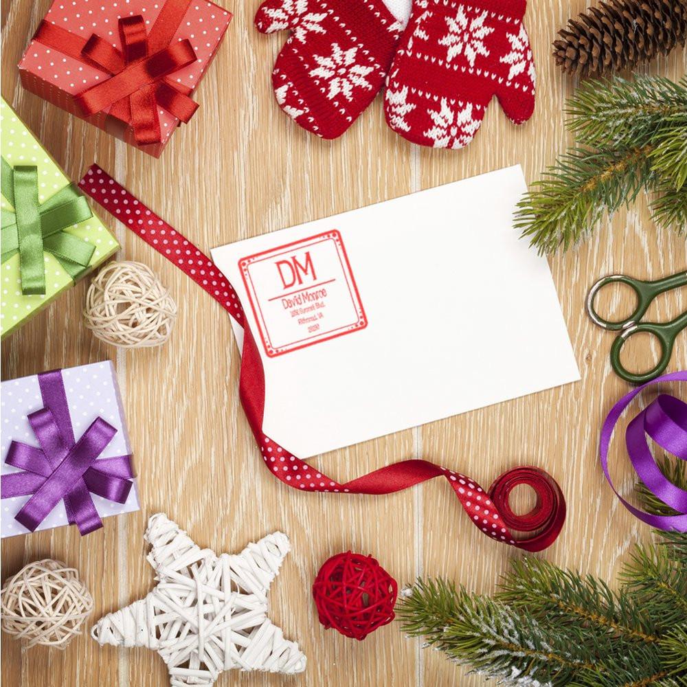 Personalized holiday return address rubber stamp on envelope for Christmas cards and festive gift wrapping
