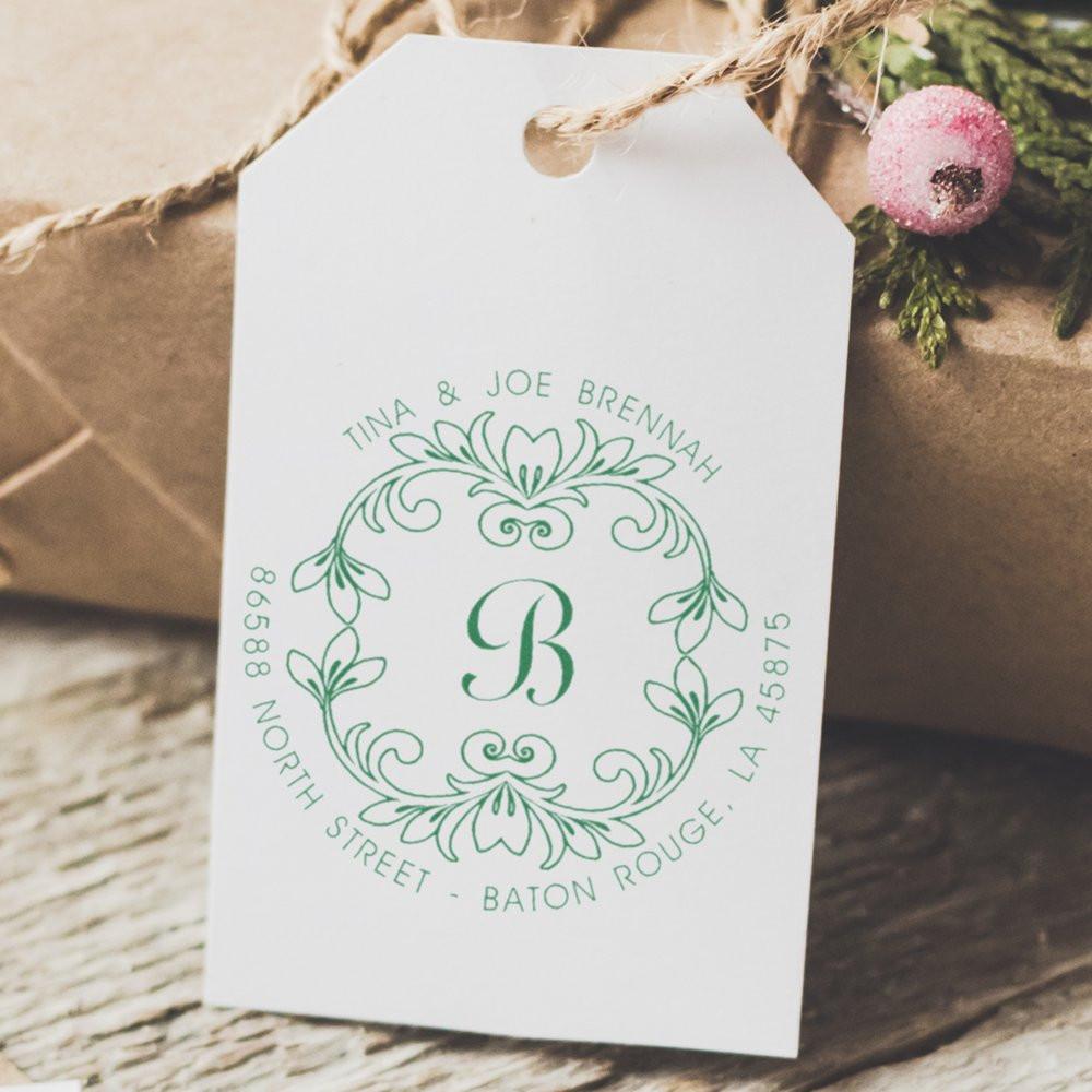 Personalized return address rubber stamp with floral monogram B on white gift tag, featuring custom name and address.