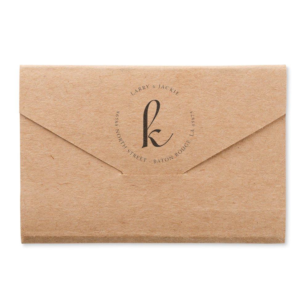Kraft paper envelope with LJ monogram and mailing address for Larrys Jackie in North Street, Baton Rouge.