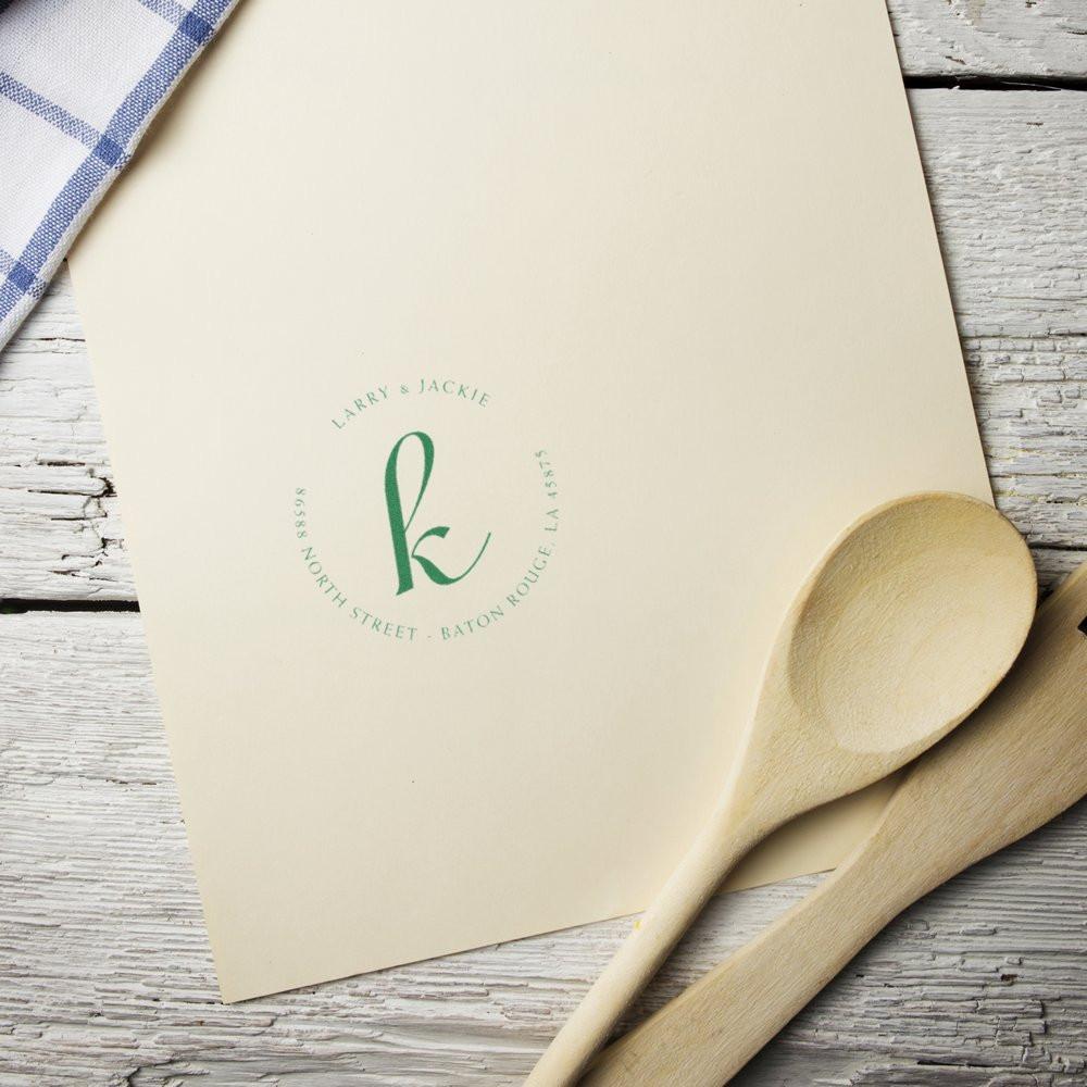 Larry & Jackie branded restaurant menu card with wooden spoon on rustic tabletop for catering and dining promotion