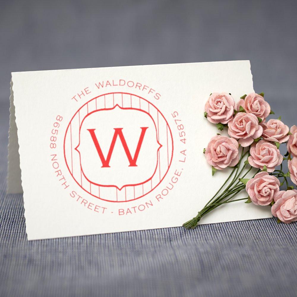 Custom personalized address rubber stamp with monogram W for The Waldorffes, Baton Rouge, LA, stamped on paper with pink flowers.